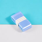Light blue S1 overgrip roll showing its smooth surface.