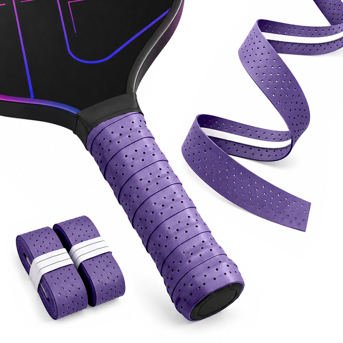 Purple R1 perforated overgrip on a pickleball paddle handle beside two rolls and a loose strip.