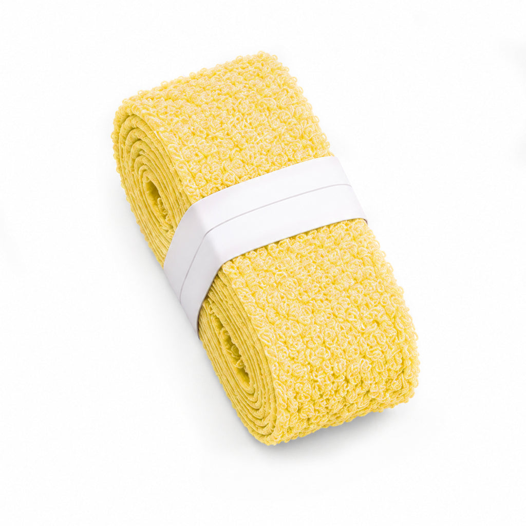 Yellow T1 towel overgrip roll.