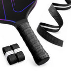 Black R1 perforated overgrip on a paddle handle with two rolls and an extended strip showing its center ridge.